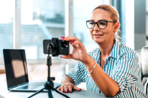 Person taking video with a phone for business