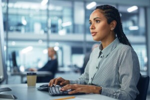 Woman working at computer in modern office setting